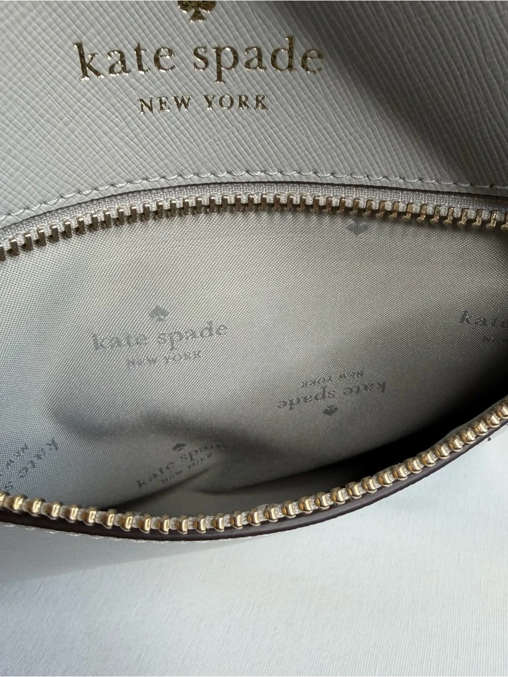 kate spade light gray saffiano leather messenger bag with gold hardware